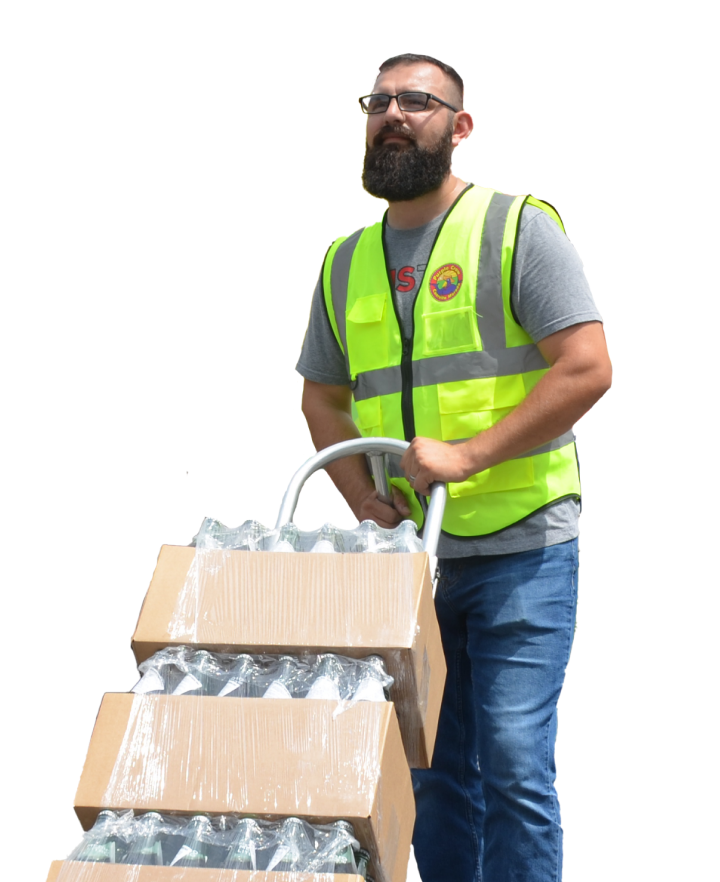 man carrying cart of water bottles
