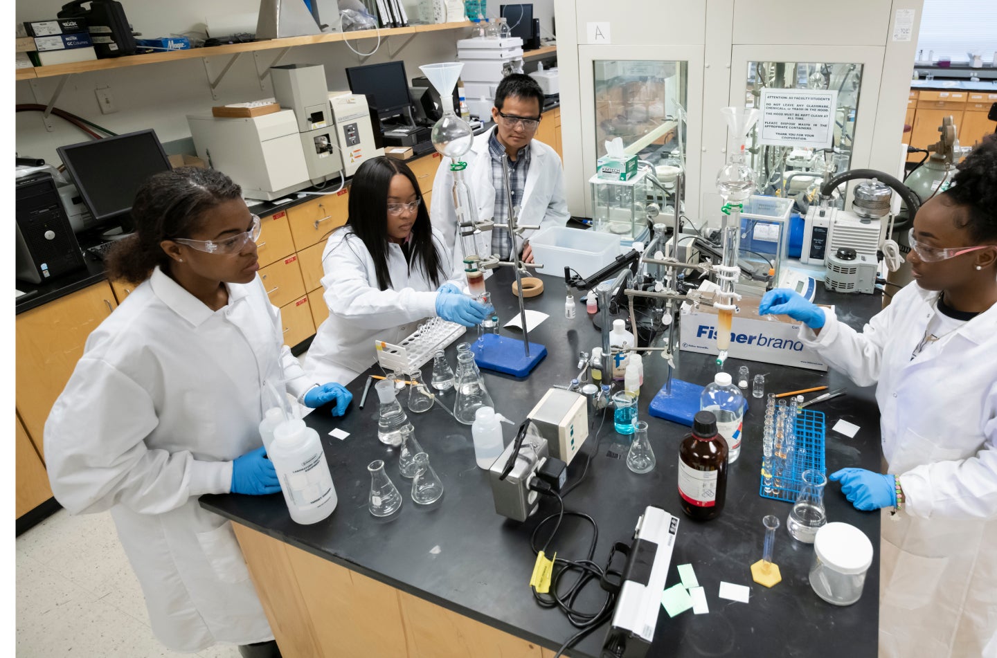 several workers working in a lab